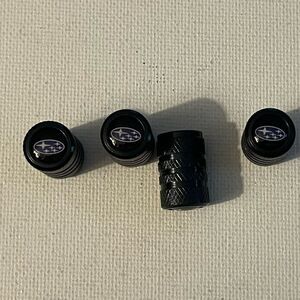 Subaru logo valve Stem caps in black set of 4 NWT